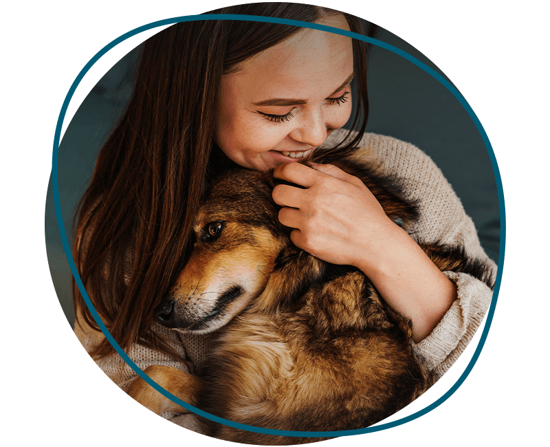 woman petting her cute dog at home during the pandemic